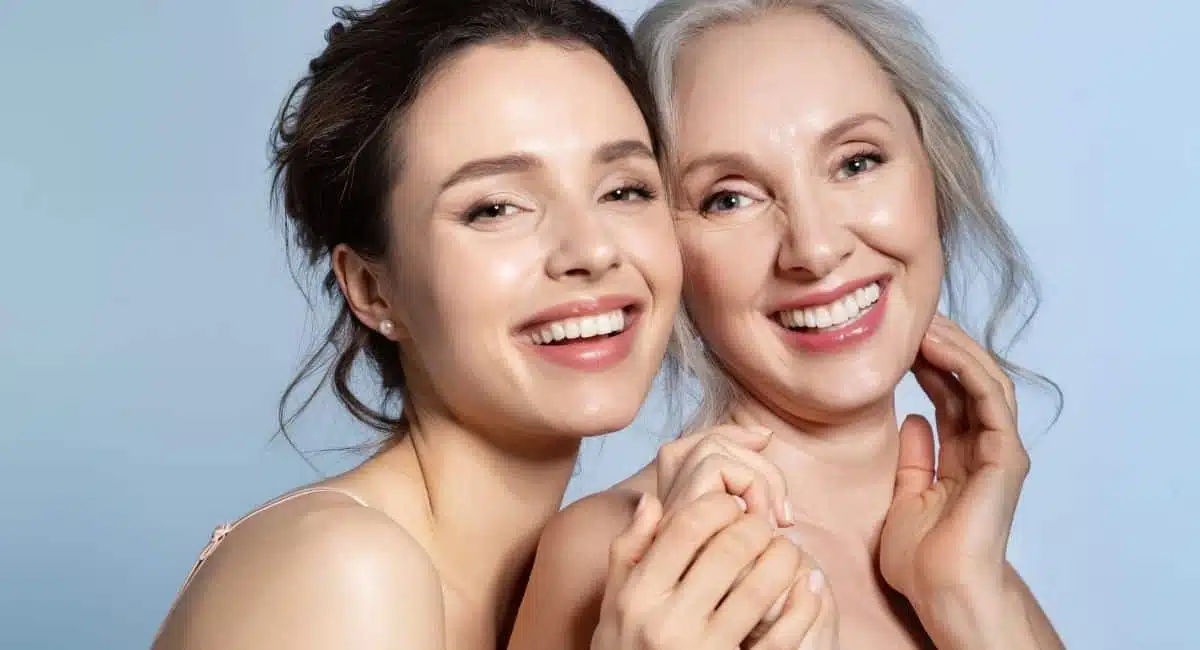 happy mother and daughter holding hands