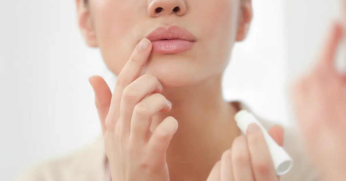 woman showing and touching her gorgeous lips